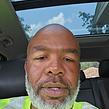 Headshot of a smiling male lawn care professional