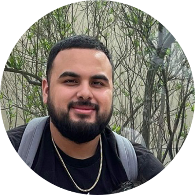 Smiling professional landscaper's headshot with an outdoor background