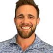 Smiling professional landscaper with a beard