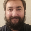Headshot of a smiling male lawn care professional