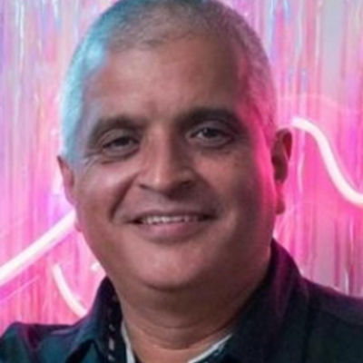 Smiling professional landscaper with a beard looking at the camera