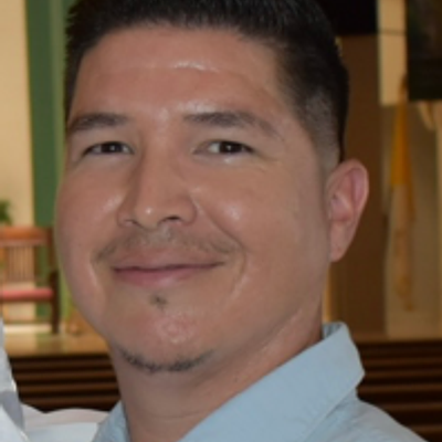 Smiling male lawn care professional