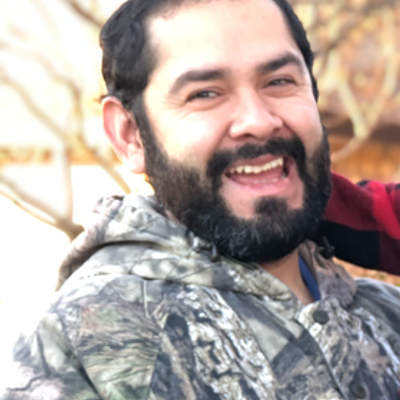 Smiling professional landscaper in work attire