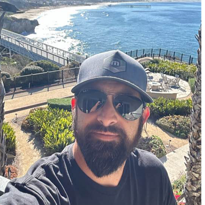 Professional headshot of a GreenPal lawn care vendor