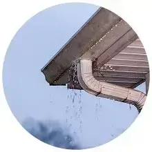 Rainwater backing up in a clogged gutter in Oceanside, CA