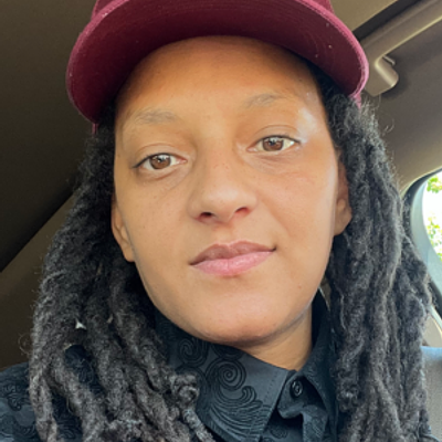 Smiling professional landscaper with a beard in a grey t-shirt